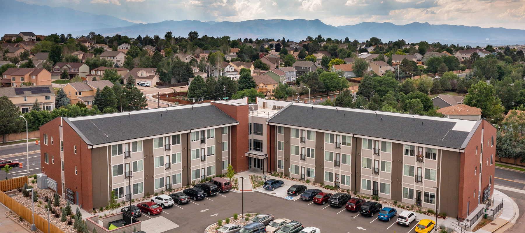 An aerial view of a multifamily building in the Rocky Mountains