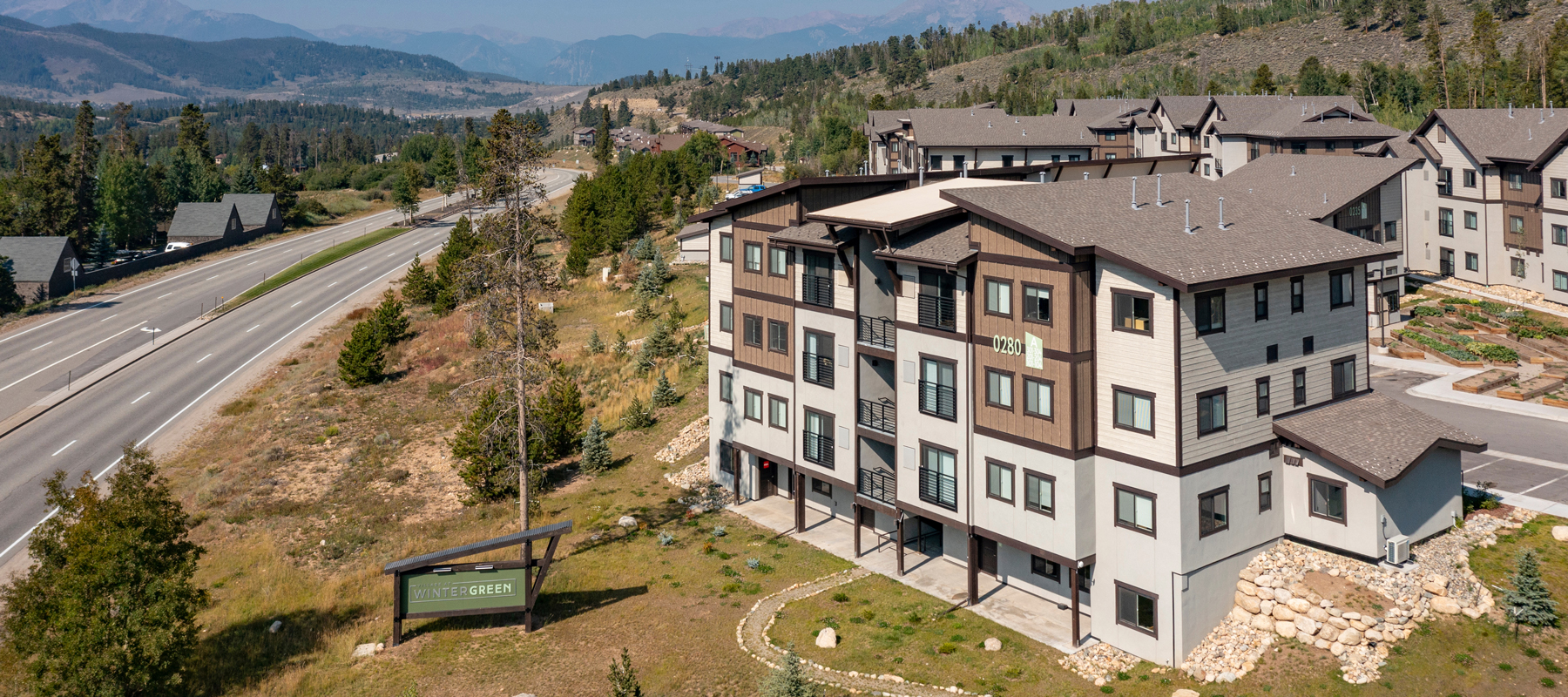 An aerial view of a multifamily building in the Rocky Mountains